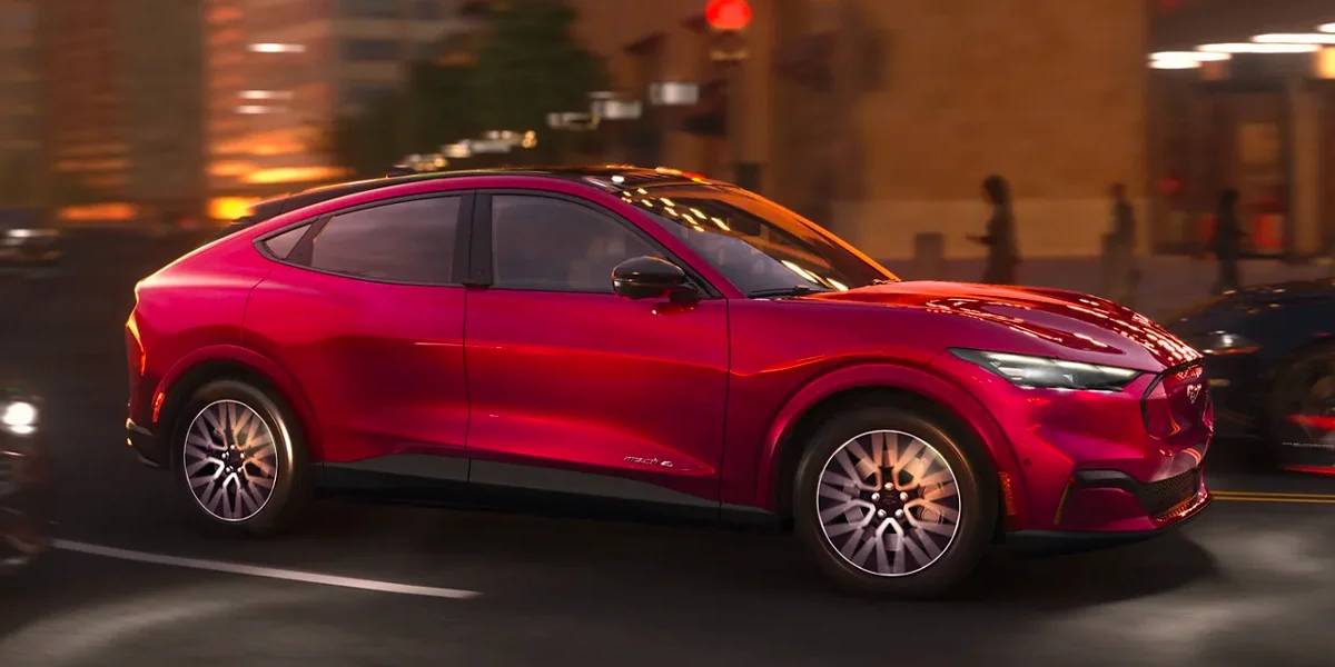 The 2025 Ford Mustang Mach-E cruising a city block